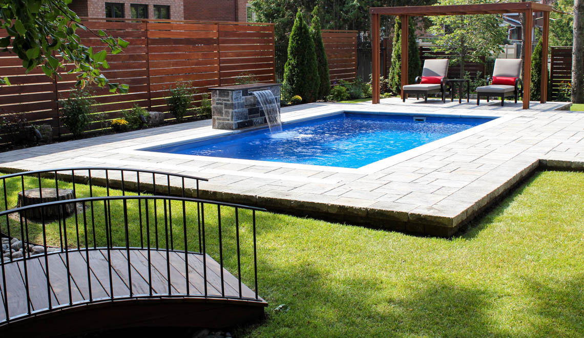 Leisure Pools Reflection composite fiberglass swimming pool with perimeter safety ledge
